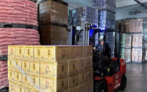 EP lithium-ion battery forklift moving pallets between racking inside a warehouse in Johor